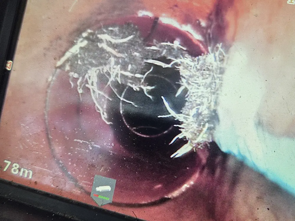 Drain camera footage on monitor showing pipe condition during a CCTV inspection in Perth