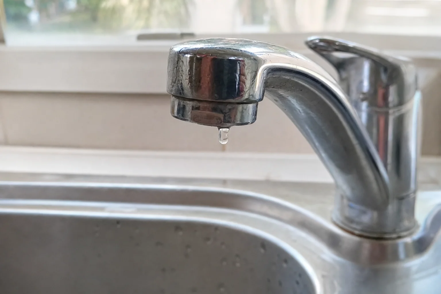 Frecks Plumbing & Gas replacing a tap washer in a Perth home bathroom